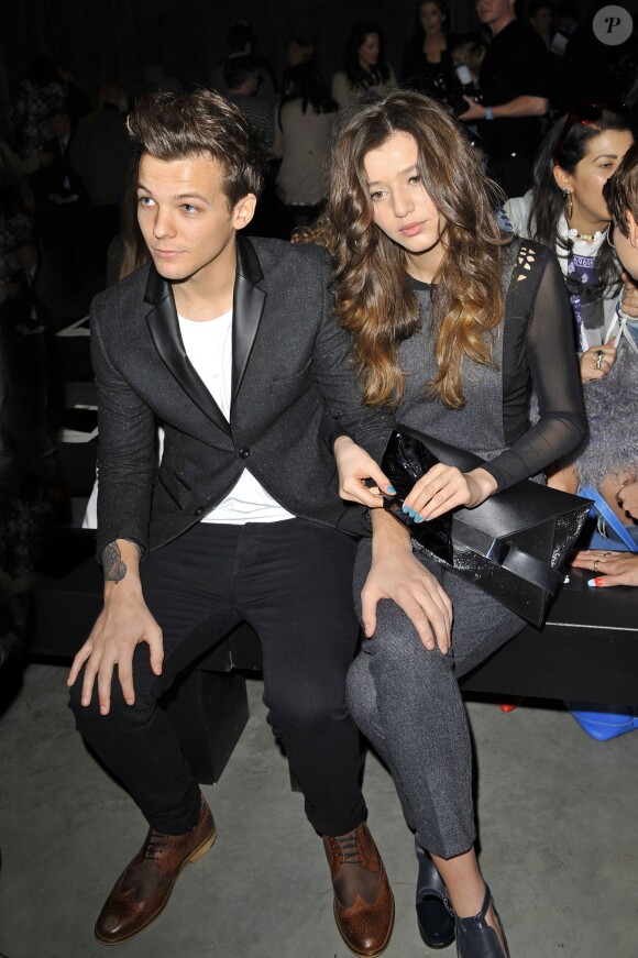 Louis Tomlinson et sa petite amie Eleanor Calder - Defile Topshop pendant la Fashion Week de Londres, le 17 fevrier 2013.  