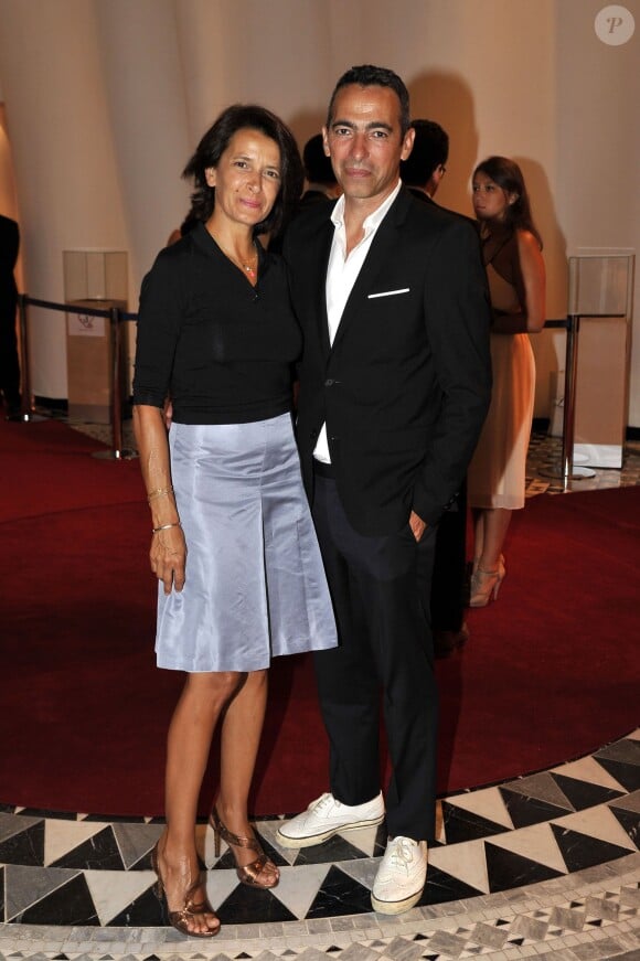 Youri Djorkaeff et sa femme Sophie le 10 juillet 2015 au Sporting de Monte-Carlo lors du gala annuel au profit de l'association Fight Aids Monaco, présidée par la princesse Stéphanie de Monaco.
