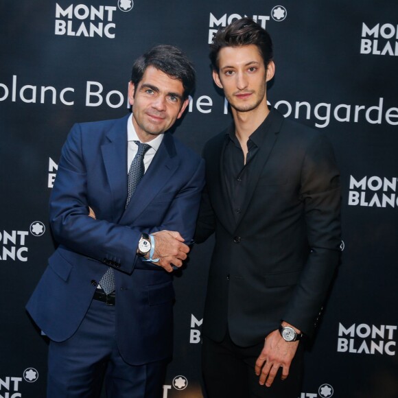 Pierre Niney et Jérôme Lambert (CEO International de Montblanc) - Lancement de la collection "Montblanc Bohème Moongarden" à l'Orangerie Ephémère du jardin des Tuileries, place de la Concorde à Paris, le 9 juillet 2015.