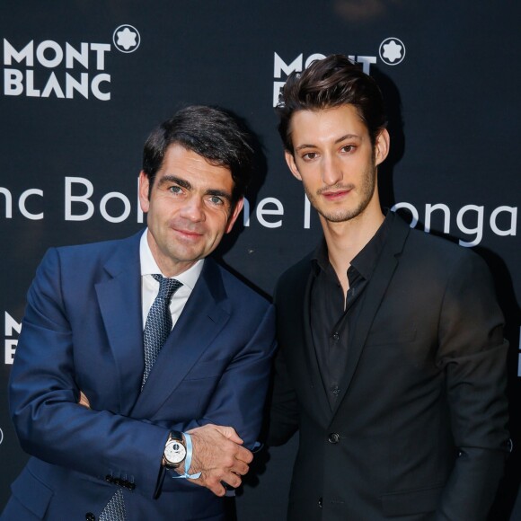 Pierre Niney et Jérôme Lambert (CEO International de Montblanc) - Lancement de la collection "Montblanc Bohème Moongarden" à l'Orangerie Ephémère du jardin des Tuileries, place de la Concorde à Paris, le 9 juillet 2015.