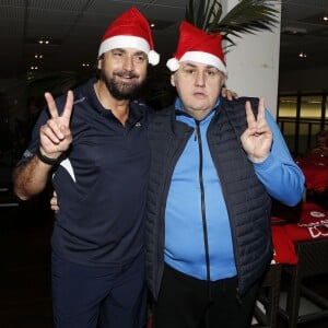 Henri Leconte et Pierre Ménès lors de la journée Enfant Star et Match - Projet Sourire Gagnant au Sporting Tennis Club de Levallois-Perret le 18 décembre 2014