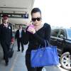 Khloé Kardashian prend un vol à l'aéroport de LAX à Los Angeles, le 13 juillet 2014. Elle porte un sac de la marque Hermès. Khloé Kardashian a évoqué pour la première fois à cœur ouvert les multiples infidélités de Lamar Odom. 