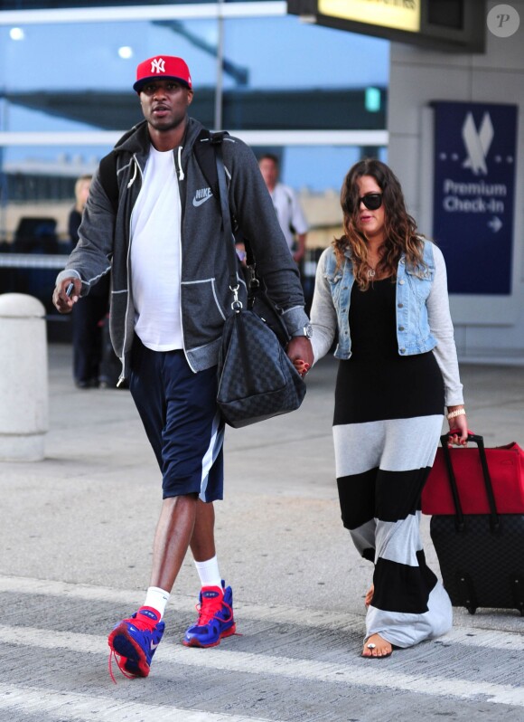 Khloe Kardashian et Lamar Odom arrivent à l'aéroport de JFK à New York, le 19 juin 2012  