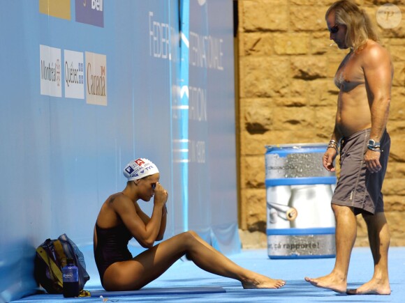 Laure Manaudou et Philippe Lucas lors des championnats du monde de natation au Parc Jean-Drapeau de Montréal, le 22 juillet 2005