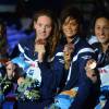 Charlotte Bonnet, Camille Muffat, Coralie Balmy et Mylène Lazare après leur médaille de bronze suite au relais 4x200 des Championnats du monde à Barcelone, le 1e août 2013