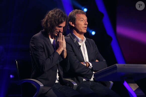 Exclusif - Jean-Luc Reichmann joue avec Xavier Mercier, gagnant des 12 coups de midi au profit de l'Association SOS Addictions, lors du tournage de l'émission spéciale des 15 ans de Qui veut gagner des millions ? (tournage le lundi 31 août 2015, diffusion le samedi 5 septembre 2015 à 20h55 sur TF1).
