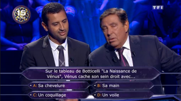 Jaafar Meziane et Jean-Pierre Foucault, dans Qui veut gagner des millions ? sur TF1, le samedi 5 septembre 2015.