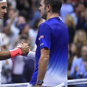 Stan Wawrinka et Roger Federer lors de leur demi-finale de l'US Open à l'USTA Billie Jean King National Tennis Center de Flushing dans le Queens à New York, le 11 septembre 2015
