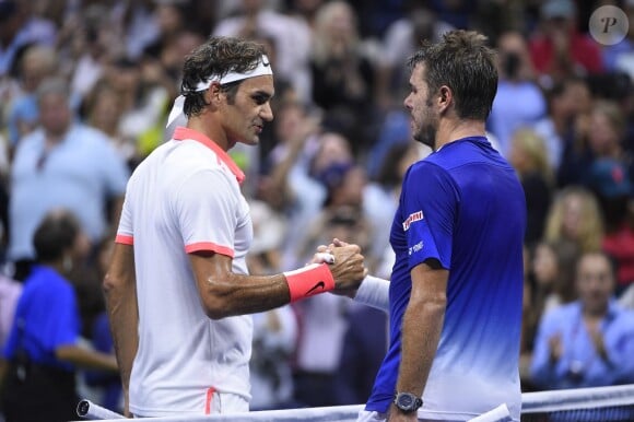 Stan Wawrinka et Roger Federer lors de leur demi-finale de l'US Open à l'USTA Billie Jean King National Tennis Center de Flushing dans le Queens à New York, le 11 septembre 2015