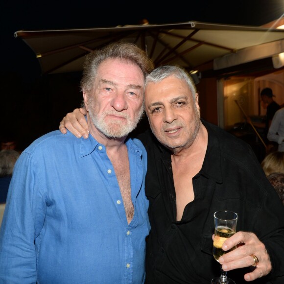 Exclusif - Eddy Mitchell et Enrico Macias lors de la soirée Marcel Campion à la plage La Bouillabaisse à Saint-Tropez, le 5 août 2015