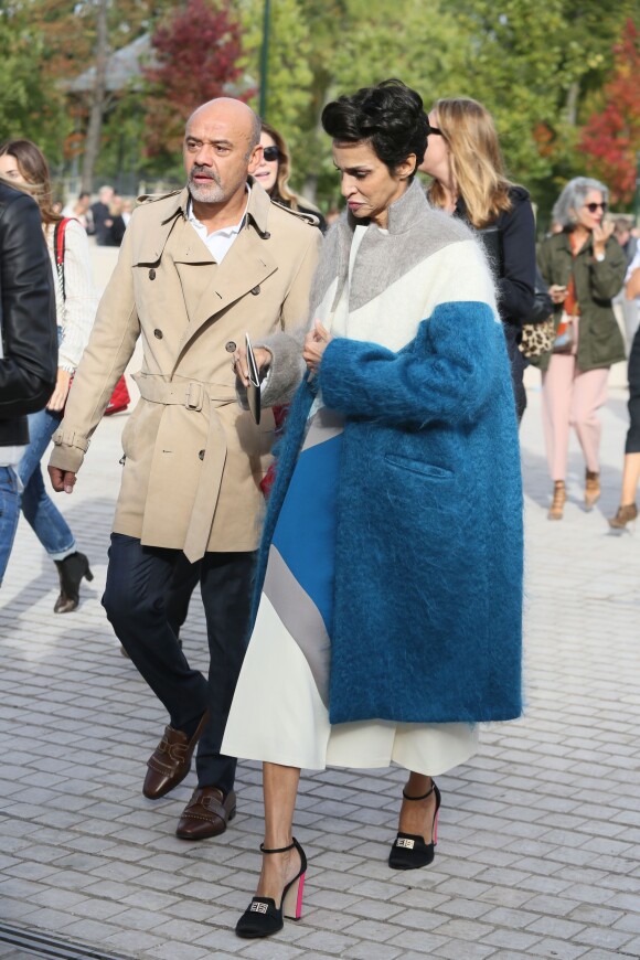 Christian Louboutin et Farida Khelfa à l'issue du défilé Louis Vuitton (collection prêt-à-porter printemps-été 2016) à la Fondation Louis Vuitton. Paris, le 7 octobre 2015.