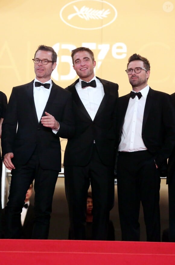 Robert Pattinson entre Guy Pearce et David Michôd - Montée des marches du film "The Rover" lors du 67 ème Festival du film de Cannes – Cannes le 18 mai 2014.