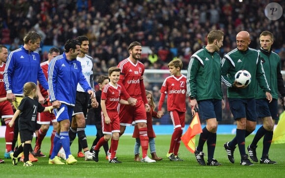 Rest of the World's Luis Figo and Great Britain & Ireland's David Beckham with his kids, Romeo (right), Cruz (left) and Harper before the UNICEF charity match at Old Trafford, Manchester, UK on November 14, 2015. Photo by Martin Rickett/PA Photos/ABACAPRESS.COM14/11/2015 - Manchester