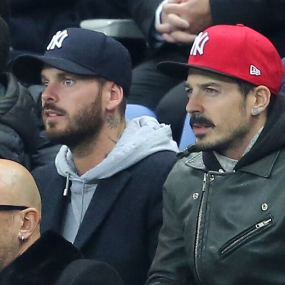 M. Pokora, Pascal Obispo et sa femme Julie Hantson - People assistent au match de football entre la France et l'Allemagne au Stade de France à Saint-Denis le 13 novembre 2015. © Cyril Moreau / Bestimage.