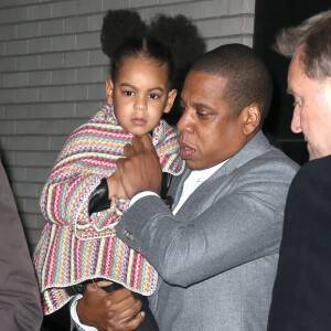 Beyonce Knowles, Jay-Z et leur fille Blue Ivy Carter à la sortie de la première de "Annie" à New York, le 7 décembre 2014