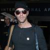 Chris Martin du groupe Coldplay arrive à l'aéroport LAX de Los Angeles le 13 décembre 2014