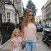 Katie Price et sa fille Princess Tiaamii quittent une clinique sur Harley Street à Londres, le 15 juillet 2014.