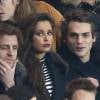 Malika Ménard et un ami, dans les tribunes du Parc des Princes à Paris, lors du match PSG - Angers, dans le cadre de la 22e journée de Ligue 1, le 23 janvier 2016. ©Cyril Moreau