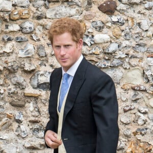 Le prince Harry au mariage de Lady Laura Marsham et James Meade à Gayton dans le Norfolk, le 14 septembre 2013.