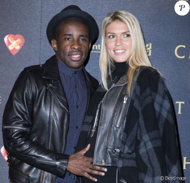 Rio Mavuba et sa femme Elodie enceinte - Avant-première du film "Chocolat" au Gaumont Champs-Elysées Marignan à Paris, le 1er février 2016.