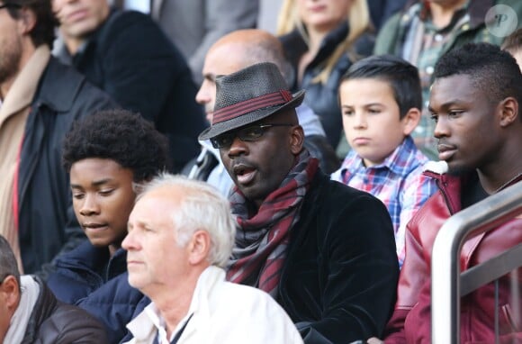 Lilian Thurama avex ses fils Kephren et Marcus lors de la rencontre entre le PSG et les Girondins de Bordeaux au Parc des Princes à Paris le 25 octobre 2014