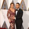 Chrissy Teigen (enceinte) et son mari John Legend - Photocall de la 88ème cérémonie des Oscars au Dolby Theatre à Hollywood. Le 28 février 2016