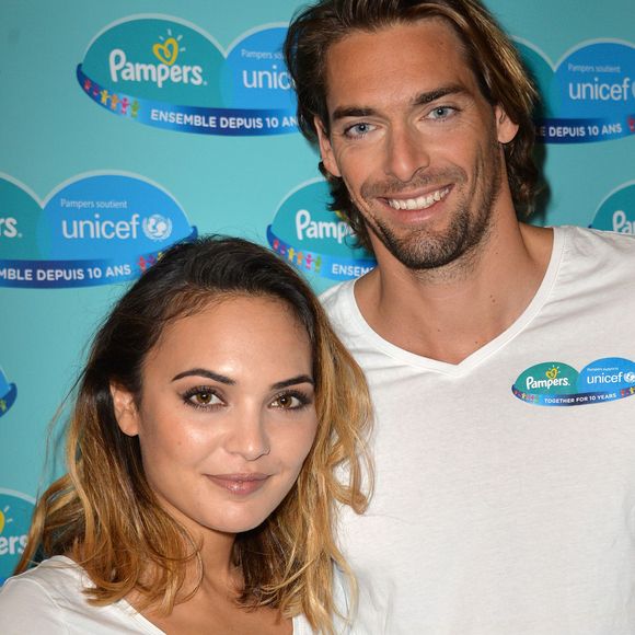 Camille Lacourt et sa femme Valérie Bègue sont les parrain et marraine du 10ème anniversaire du partenariat entre Pampers et l'Unicef pour le vaccin des enfants contre le tétanos. Paris, le 13 novembre 2015