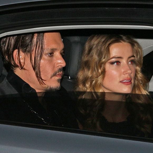 Johnny Depp et sa femme Amber Heard rentrent à leur hôtel après la première du film Black Mass à Londres, le 11 octobre 2015.