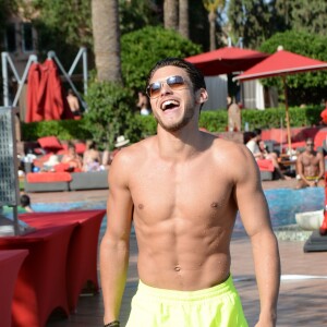 Exclusif - Rayane Bensetti se relaxe dans une piscine dans le cadre du Marrakech du rire à Marrakech le 4 juin 2016. © Rachid Bellak/Bestimage