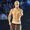 Justin Bieber en concert à Seattle le 9 mars 2016.  03/09/2016 First Night Photos!! Justin Bieber Kicks off His Purpose Tour in Seattle last night. Justin whipped his top halfway through the evening revealing his tattooed and muscular body. Justin looked to be ready to tackle the growling schedule associated with performing a world tour. The hitmaker pulled out all the stops last evening playing a full set from acoustic guitar to piano ballads and at one point during the night in the midst of throwing down some serious dance moves Justin produced a rain machine which left the veteran performer soaked to the bone!!10/03/2016 - Seattle