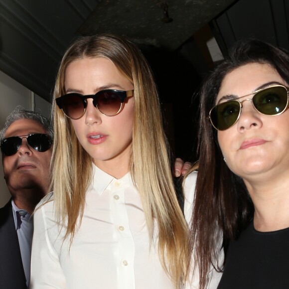 Amber Heard arrive au tribunal pour sa déposition contre Johnny Depp pour violences conjugales dans la procédure de divorce à Century City, le 13 août 2016.