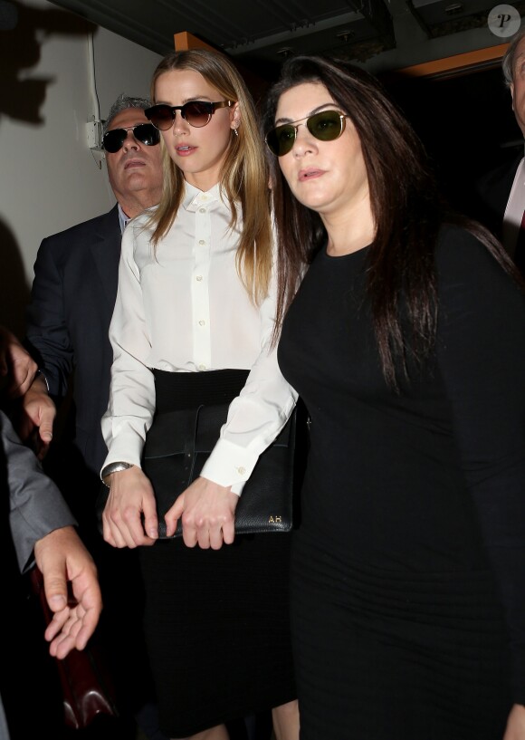 Amber Heard arrive au tribunal pour sa déposition contre Johnny Depp pour violences conjugales dans la procédure de divorce à Century City, le 13 août 2016.