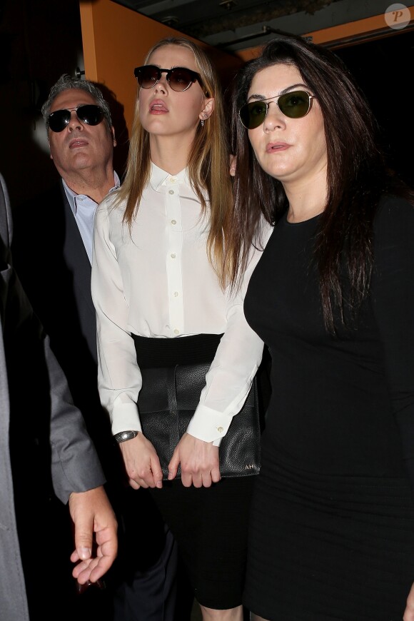 Amber Heard arrive au tribunal pour sa déposition contre Johnny Depp pour violences conjugales dans la procédure de divorce à Century City, le 13 août 2016.