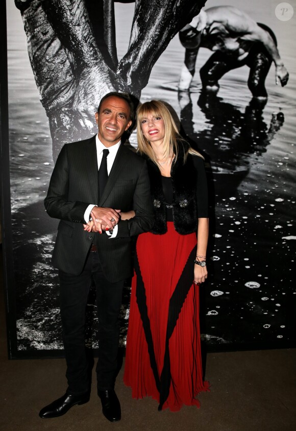 Nikos Aliagas et sa compagne Tina Grigoriou - Inauguration de l'exposition photographique de Nikos Aliagas intitulée "Corps et âmes" à la Conciergerie à Paris le 23 Mars 2016. © Dominique Jacovides / Bestimage