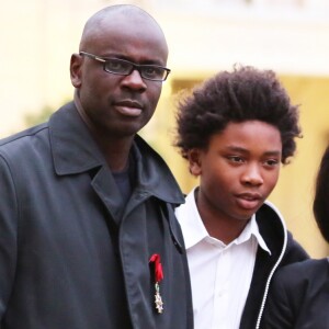 Lilian Thuram élevé au grade d'Officier de la Legion d'honneur par le president de la republique Francois Hollande au palais de l'Elysee à Paris le 17 septembre 2013, en présence de son fils Khephren.