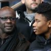 Lilian Thuram et son fils Khephren au PSG - Reims lors de la 27ème journée de Ligue 1 au Parc des Princes à Paris, le 20 février 2016.