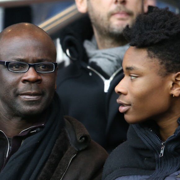 Lilian Thuram et son fils Khephren au PSG - Reims lors de la 27ème journée de Ligue 1 au Parc des Princes à Paris, le 20 février 2016.