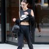Bella Hadid goes all out looking trendy in athleisure after visiting her sister Gigi Hadid's apartment. Bella wore mostly all black, sporting a Nike crop top, black lace bra, black track pants, white Nike hightops, a black jacket, and mirrored sunglasses. New York City, NY, USA. Photo by GSI/ABACAPRESS.COM09/05/2016 - New York City