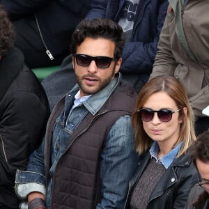 Maxim Nucci (Yodelice) et sa compagne Isabelle Ithurburu dans les tribunes des Internationaux de France de tennis de Roland Garros à Paris. Le 24 mai 2016 © Dominique Jacovides / Bestimage