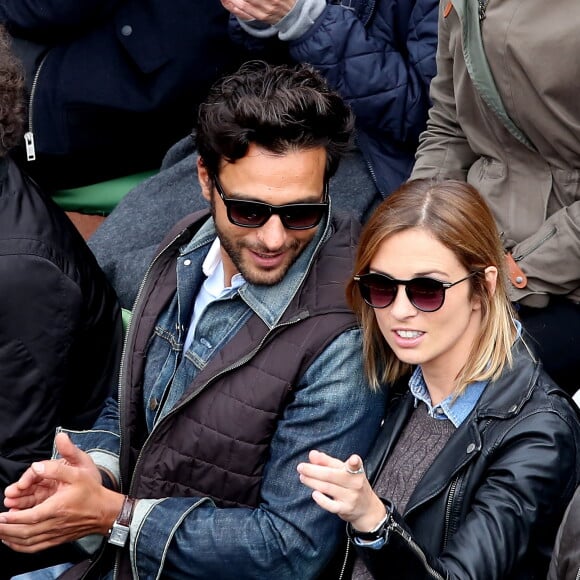 Maxim Nucci (Yodelice) et sa compagne Isabelle Ithurburu dans les tribunes des Internationaux de France de tennis de Roland Garros à Paris. Le 24 mai 2016 © Dominique Jacovides / Bestimage