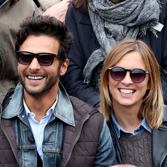 Maxim Nucci (Yodelice) et sa compagne Isabelle Ithurburu dans les tribunes des Internationaux de France de tennis de Roland Garros à Paris. Le 24 mai 2016 © Dominique Jacovides / Bestimage