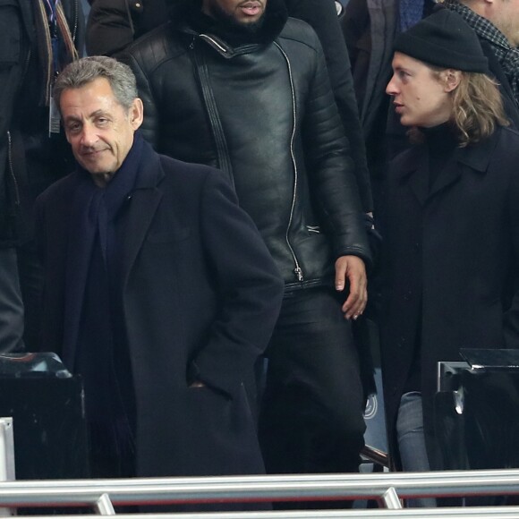 Pierre Sarkozy, Nicolas Sarkozy et Axel Tony (Axel Tonye) dans les tribunes lors du match de Ligue 1 Paris Saint-Germain - Toulouse FC au parc des Princes à Paris, France, le 19 février 2017. Le PSG fait match nul 0-0 contre le TFC. © Cyril Moreau/Bestimage