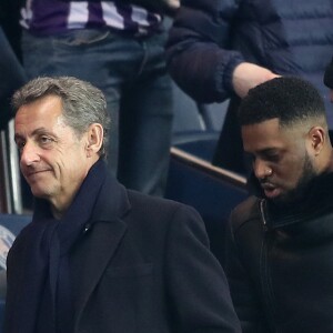 Pierre Sarkozy, Nicolas Sarkozy et Axel Tony (Axel Tonye) dans les tribunes lors du match de Ligue 1 Paris Saint-Germain - Toulouse FC au parc des Princes à Paris, France, le 19 février 2017. Le PSG fait match nul 0-0 contre le TFC. © Cyril Moreau/Bestimage