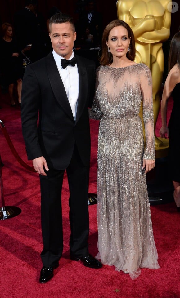 Brad Pitt et Angelina Jolie (habillée en Elie Saab) - 86ème cérémonie des Oscars à Hollywood, le 2 mars 2014