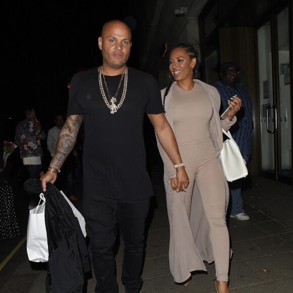 Melanie Brown (Mel B) et son mari Stephen Belafonte sortent du restaurant "Novikov", situé dans le quartier de Mayfair à Londres, le 12 mai 2016.