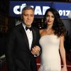 Exclusif - George Clooney (montre Omega) et sa femme Amal Alamuddin-Clooney (enceinte) - Arrivées à la 42e cérémonie des Cesar à la salle Pleyel à Paris, le 24 février 2017.