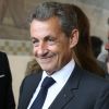 L'ancien président Nicolas Sarkozy et sa femme Carla Bruni-Sarkozy votent pour le premier tour des élections présidentielles au lycée La Fontaine à Paris le 23 avril 2017.