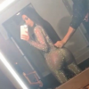 Photo de Kim Kardashian, habillée d'un haut et d'un legging en résille Gucci. Août 2017.