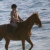 Exclusif - Madonna fait une balade à cheval sur la plage de Comporta avec son fils David, le 8 octobre 2017.