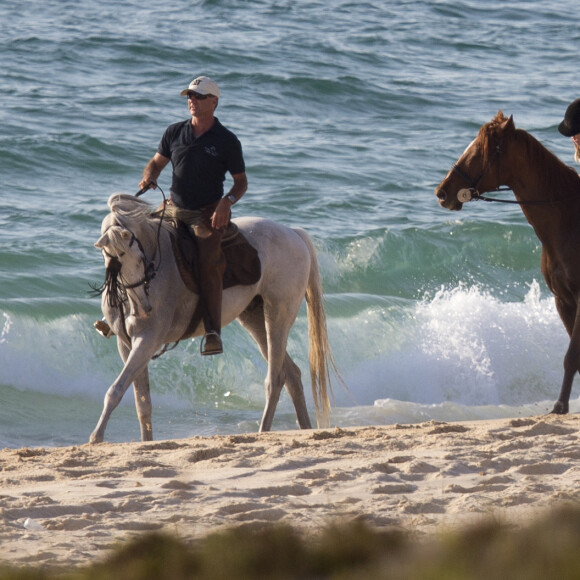 Exclusif - Madonna fait une balade à cheval sur la plage de Comporta avec son fils David, le 8 octobre 2017.